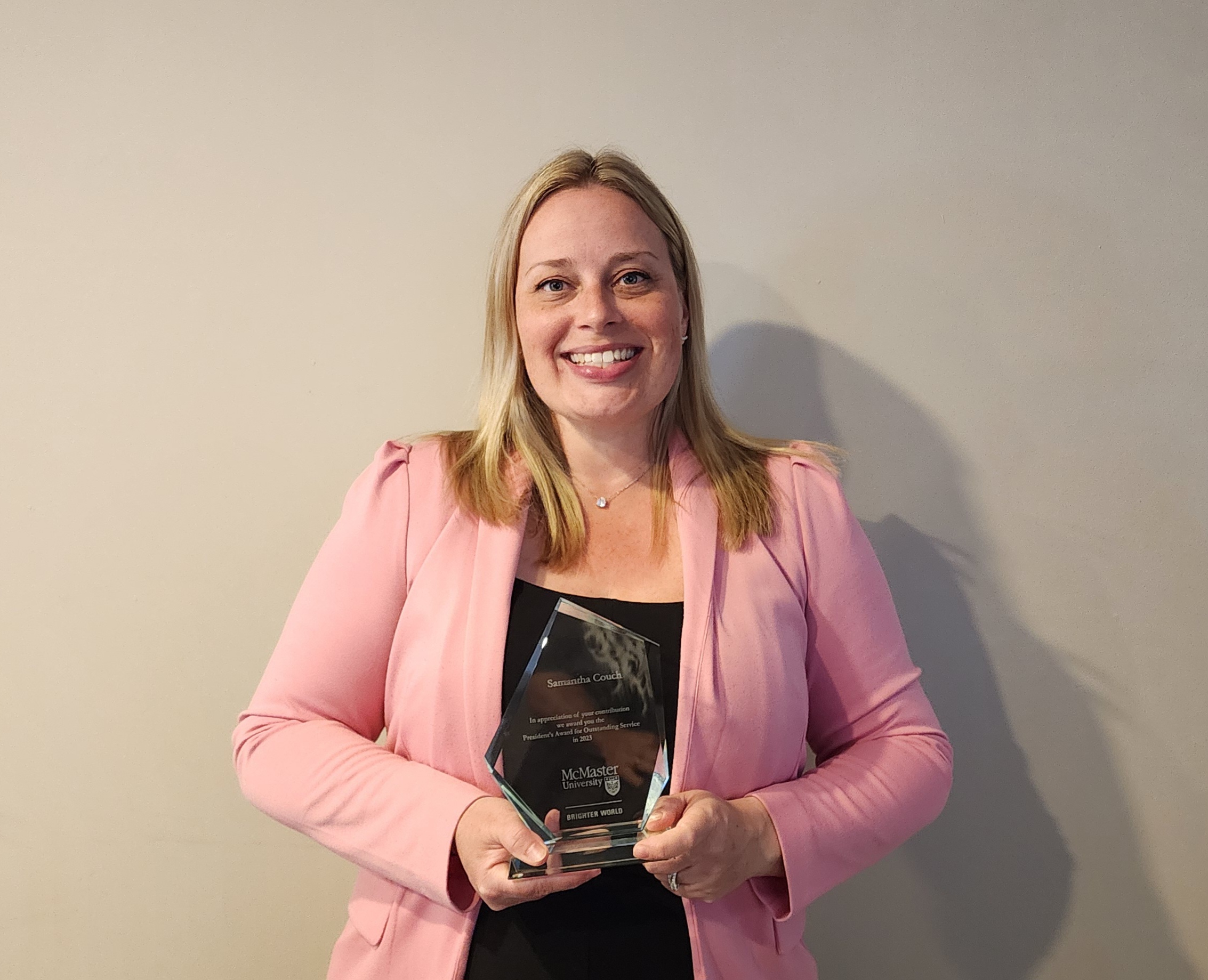 A photo of Sam Couch with her award.