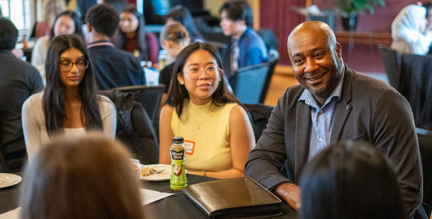 Photo of people chatting at a networking breakfast.